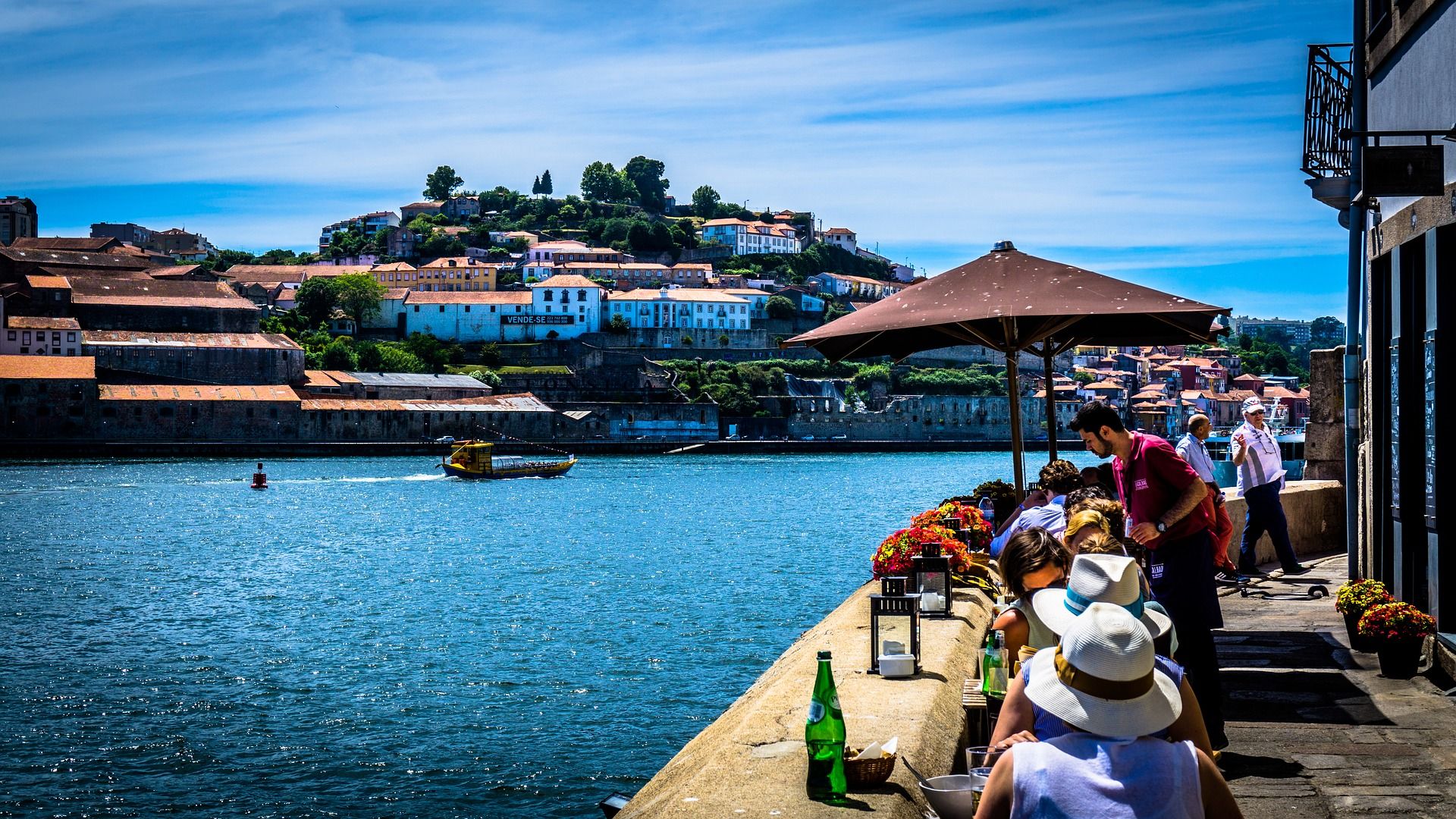 View of the riverside area of the city with a rabelo boat, used for centuries to transport supplies and port wine along the Douro River.